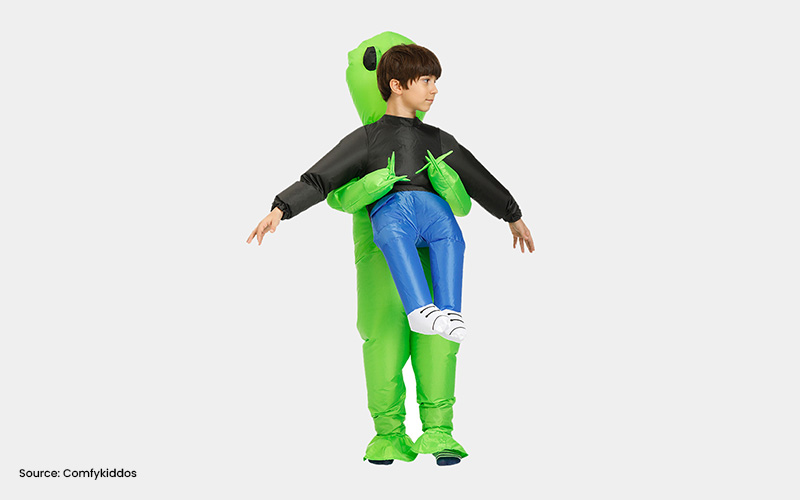 Child wearing an inflatable alien abduction illusion costume.